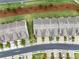 Aerial view of a townhome community featuring manicured lawns, landscaping and convenient street parking at 2089 Lanier Harbor Pt # 2089, Buford, GA 30518