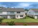 Backyard featuring a well-maintained lawn and a partially fenced area for outdoor enjoyment and privacy at 2089 Lanier Harbor Pt # 2089, Buford, GA 30518