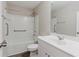 Bright bathroom featuring a tub with shower, safety bars, and modern vanity with sink at 2089 Lanier Harbor Pt # 2089, Buford, GA 30518
