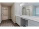 Bathroom with double vanity, undermount sinks, and a view to the other rooms at 2089 Lanier Harbor Pt # 2089, Buford, GA 30518