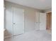 Neutral bedroom with carpet, white doors, and ample closet space at 2089 Lanier Harbor Pt # 2089, Buford, GA 30518