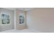 A bedroom showcasing two windows with neighborhood views at 2089 Lanier Harbor Pt # 2089, Buford, GA 30518