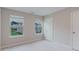Bright bedroom with neutral walls, two windows, and a view of the neighborhood at 2089 Lanier Harbor Pt # 2089, Buford, GA 30518
