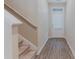 Inviting entryway featuring wood-look floors, stairs, and a well-lit front door at 2089 Lanier Harbor Pt # 2089, Buford, GA 30518