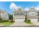 Charming two-story townhome with a well-manicured lawn and two-car garage for convenient parking at 2089 Lanier Harbor Pt # 2089, Buford, GA 30518