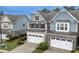A high angle view of this lovely two-story townhome, with its well-kept lawn and landscaping at 2089 Lanier Harbor Pt # 2089, Buford, GA 30518