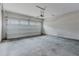 Spacious two car garage with a sealed concrete floor and functioning garage door at 2089 Lanier Harbor Pt # 2089, Buford, GA 30518