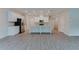 Spacious kitchen with white cabinets, stainless steel appliances, and large center island at 2089 Lanier Harbor Pt # 2089, Buford, GA 30518