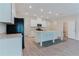 Open-concept kitchen with white cabinets, granite countertops, and a functional island at 2089 Lanier Harbor Pt # 2089, Buford, GA 30518