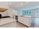 Sunlit kitchen with island, stainless steel appliances, granite countertops, and modern design at 2089 Lanier Harbor Pt # 2089, Buford, GA 30518