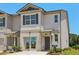 Charming two-story townhouse with a mix of siding and brick, landscaped front yard, and a welcoming entrance at 2364 Haran Dr # 35, Lithonia, GA 30058