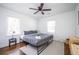 Bedroom featuring a bed with gray linens, hardwood floors, and a ceiling fan at 1105 Gun Club Nw Rd, Atlanta, GA 30318