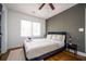 Well lit bedroom with hardwood floors, neutral walls, double window, and ceiling fan at 1105 Gun Club Nw Rd, Atlanta, GA 30318
