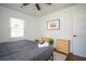 Bedroom featuring a bed with gray linens, hardwood floors, and a ceiling fan at 1105 Gun Club Nw Rd, Atlanta, GA 30318