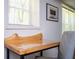 A contemporary desk with wooden top next to the window and seating with a painting on the wall at 1105 Gun Club Nw Rd, Atlanta, GA 30318