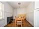 Bright dining room featuring wood floors, stylish lighting, and built-in cabinetry for storage at 1105 Gun Club Nw Rd, Atlanta, GA 30318