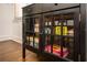 A cabinet with a glass door, filled with board games for Gathering entertainment at 1105 Gun Club Nw Rd, Atlanta, GA 30318