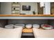 Kitchen island is designed with storage for dishware and seating with decoratively upholstered stools at 1105 Gun Club Nw Rd, Atlanta, GA 30318