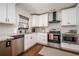 Modern kitchen boasting granite counters, stainless appliances, and sleek white cabinetry at 1105 Gun Club Nw Rd, Atlanta, GA 30318