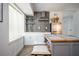 A modern kitchen is designed with an island, stainless steel appliances, and white cabinets at 1105 Gun Club Nw Rd, Atlanta, GA 30318