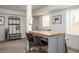 A dining area shows seating, a coat rack, windows, and neutral colored walls at 1105 Gun Club Nw Rd, Atlanta, GA 30318
