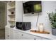 Kitchen area features built-in shelving, microwave, drawers, and modern decor at 1105 Gun Club Nw Rd, Atlanta, GA 30318