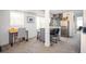 Functional kitchenette with stainless steel appliances, tile backsplash, and eat-in island at 1105 Gun Club Nw Rd, Atlanta, GA 30318