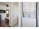 Laundry room with a stackable washer and dryer and open hallway to the bedroom at 1105 Gun Club Nw Rd, Atlanta, GA 30318