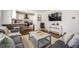 Inviting living room with hardwood floors, stylish furnishings, and an open layout to the kitchen at 1105 Gun Club Nw Rd, Atlanta, GA 30318