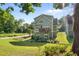 Expansive backyard with a view of the deck, patio, and landscaped area with a footbridge at 1810 Annie Nw St, Atlanta, GA 30318