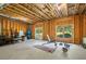 Unfinished basement with open layout, exposed ceiling, and a large window for natural light at 1810 Annie Nw St, Atlanta, GA 30318