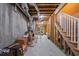 Unfinished basement with exposed beams, concrete walls, and ample space for storage or customization at 1810 Annie Nw St, Atlanta, GA 30318