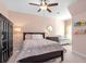 Comfortable bedroom with a crib, ceiling fan, and light pink walls at 1810 Annie Nw St, Atlanta, GA 30318