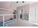 Cozy bedroom featuring a house frame bed, carpet floors and access to the bathroom at 1810 Annie Nw St, Atlanta, GA 30318