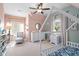 Charming bedroom featuring stylish decor, neutral walls and carpet, with natural light and ceiling fan at 1810 Annie Nw St, Atlanta, GA 30318