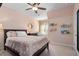 Cozy bedroom with crib, ceiling fan, and coral patterned bedding at 1810 Annie Nw St, Atlanta, GA 30318