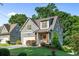 Charming home with a covered front porch, well-maintained landscaping, and a driveway at 1810 Annie Nw St, Atlanta, GA 30318