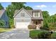 Charming home showcasing a well-maintained front yard and a two-car garage at 1810 Annie Nw St, Atlanta, GA 30318