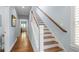 Bright hallway with hardwood floors and staircase leading to the upper level at 1810 Annie Nw St, Atlanta, GA 30318