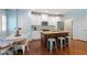 Well-lit kitchen with island, stainless appliances, and adjacent breakfast nook at 1810 Annie Nw St, Atlanta, GA 30318