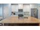 Kitchen with a large island featuring a sink and stainless steel appliances at 1810 Annie Nw St, Atlanta, GA 30318