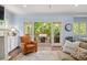 Bright living room with fireplace and access to the outdoor patio at 1810 Annie Nw St, Atlanta, GA 30318