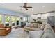 Open concept living room and kitchen area with stainless steel appliances and hardwood floors at 1810 Annie Nw St, Atlanta, GA 30318
