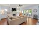 Comfortable living room with fireplace, plush sofa, and lots of natural light at 1810 Annie Nw St, Atlanta, GA 30318
