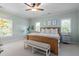 Serene bedroom with neutral carpet, a ceiling fan, and lots of natural light at 1810 Annie Nw St, Atlanta, GA 30318
