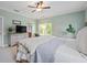 Comfortable bedroom with large bed, ceiling fan, and peaceful ambiance at 1810 Annie Nw St, Atlanta, GA 30318