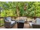 Spacious patio with comfortable seating around a modern fire pit at 1810 Annie Nw St, Atlanta, GA 30318
