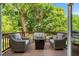Outdoor patio with comfortable seating, a fire pit, and views of the surrounding nature at 1810 Annie Nw St, Atlanta, GA 30318