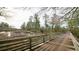 Enjoy a scenic stroll on the wooden walkway, surrounded by lush greenery and natural beauty at 2360 Haran Dr # 34, Lithonia, GA 30058