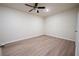 Bright bedroom features modern ceiling fan and sleek laminate flooring at 458 Bishop Ln, Woodstock, GA 30188
